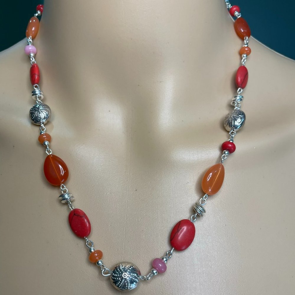 Silver and coral stone set necklace, bracelet, and earrings